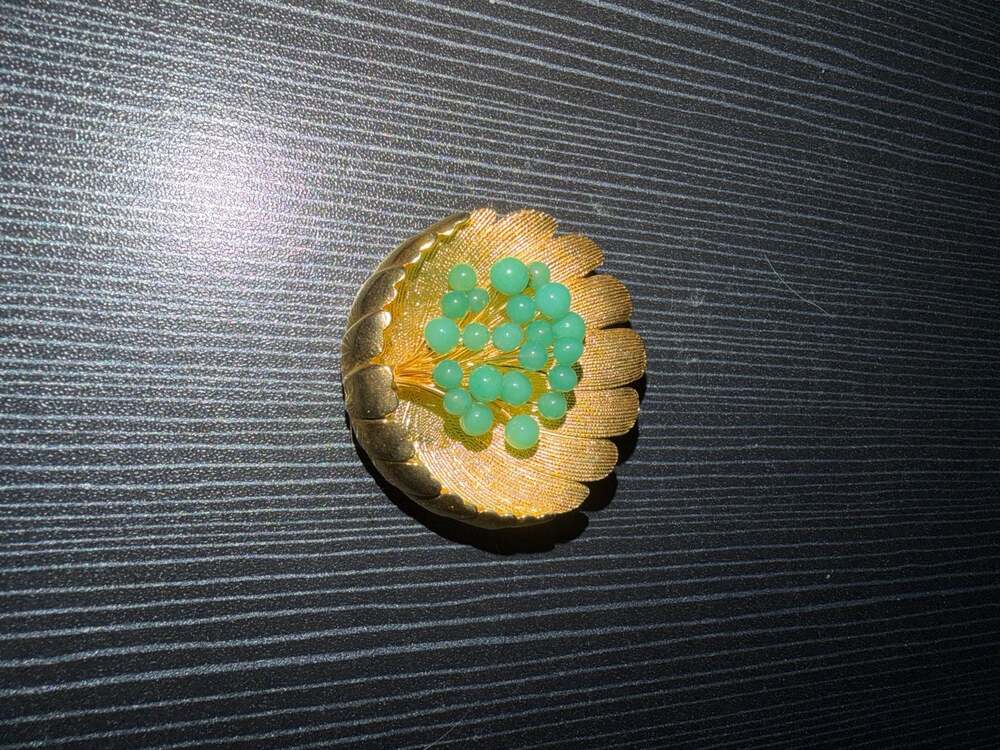 Vintage Trifari Crown Gold Tone Textured Shell Brooch with Green Faux Jade Beads
